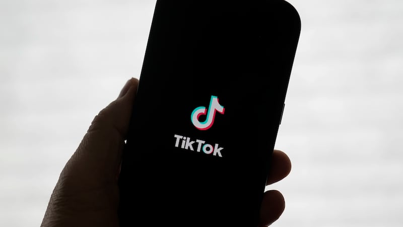A TikTok logo is shown on a phone in San Francisco, Friday, Jan. 17, 2025. (AP Photo/Jeff Chiu)